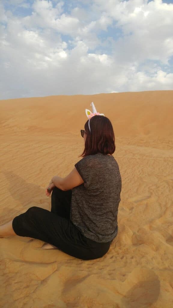This is what my Dubai Desert Safari outfit looked like, unicorn, sand, dunes 