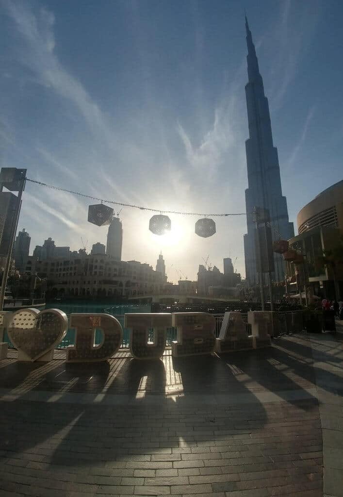 Dubai sign in front of Burj Khalifa, Dubai Mall, Dubai Fountain