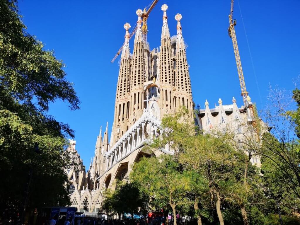 View of Sagrada Familia from one of the mini-parks (Passion Facade), church, Barcelona