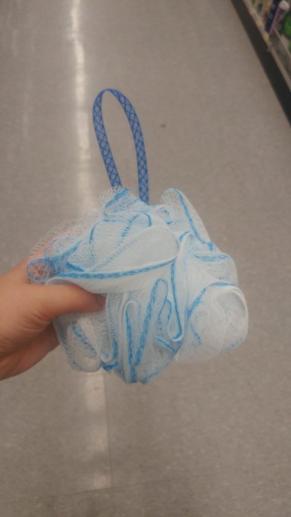 A blue and white loofa from the Dollar Store