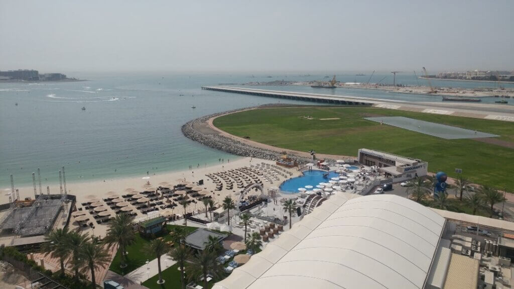 View towards the Skydive Dubai landing field and a resort with a beach, Dubai, UAE
