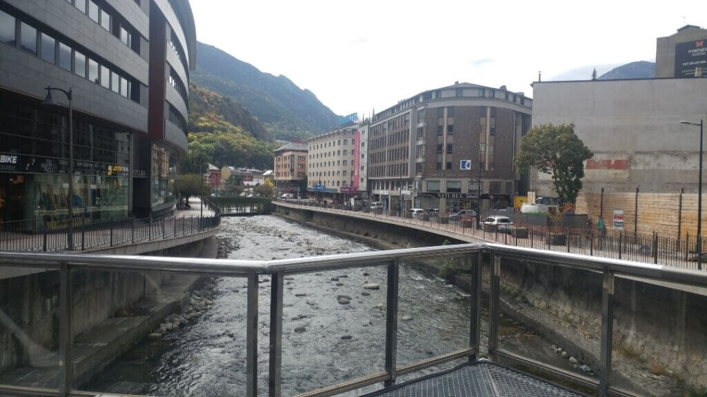 Street view of Andora La Vella with Riu Gran Valira creek, creek, mountains, Barcelona to Andorra bus