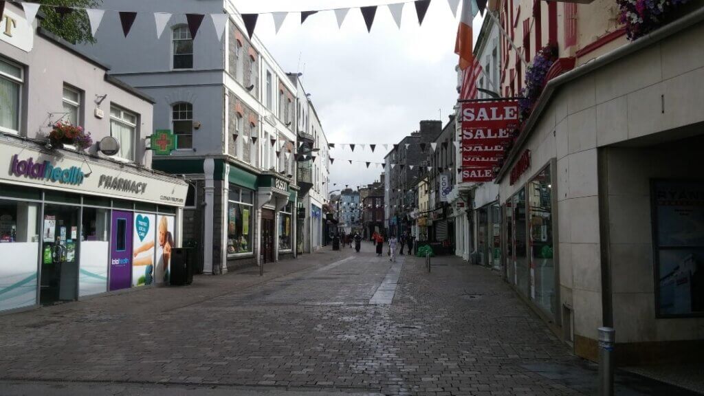 The streets of Galway, road lined with shops 