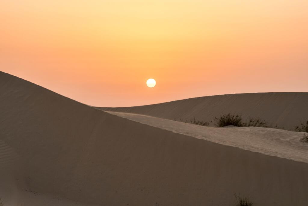 Beautiful sunset in the desert, UAE, Dubai desert tour