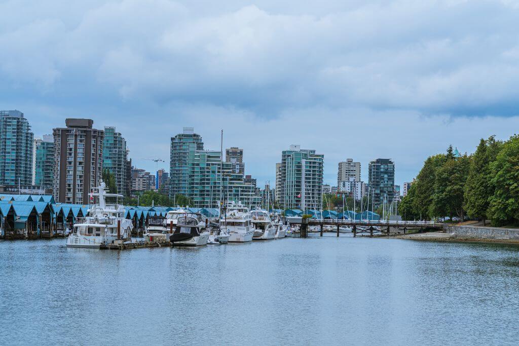 View towards Vancouver City from Stanley Park, boats, city buildings