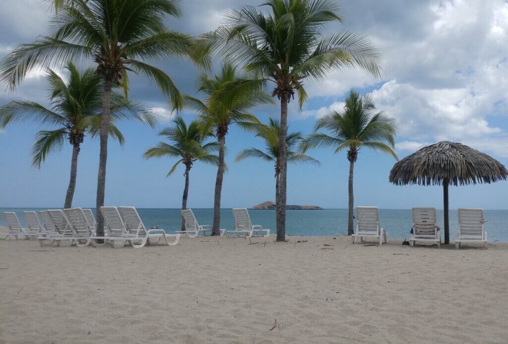 View from Playa Blanca, palm trees, sand, beach, beach chairs