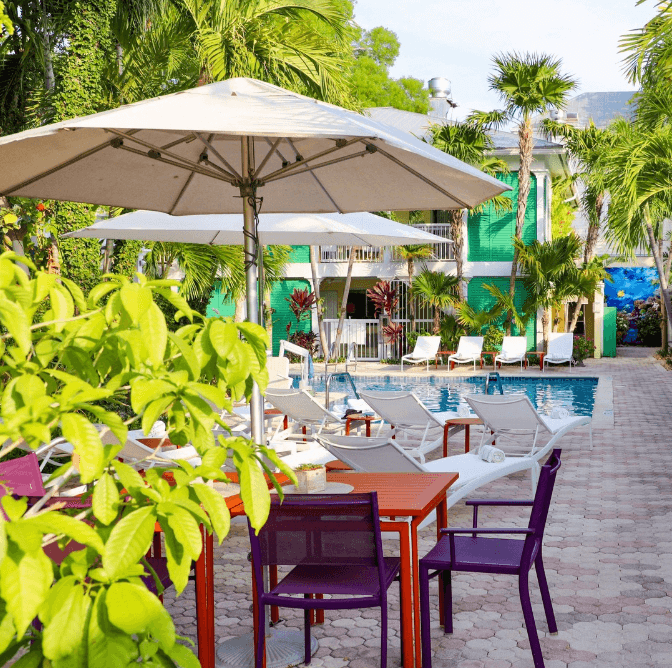 Almond Tree Inn, pool, sun umbrellas, lounge chairs 