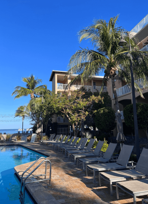Romantic Florida Keys resorts - Key West Marriott Beachside, palm trees, pool, lounge chairs