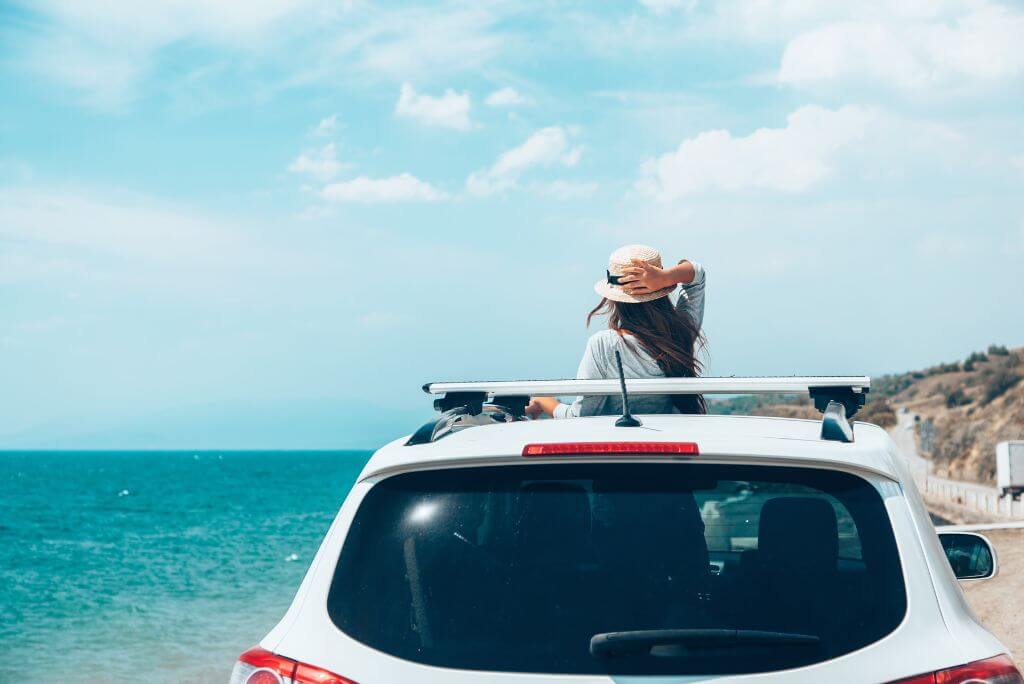 Girl in a white car, beach, sea, ocean, solo trip
