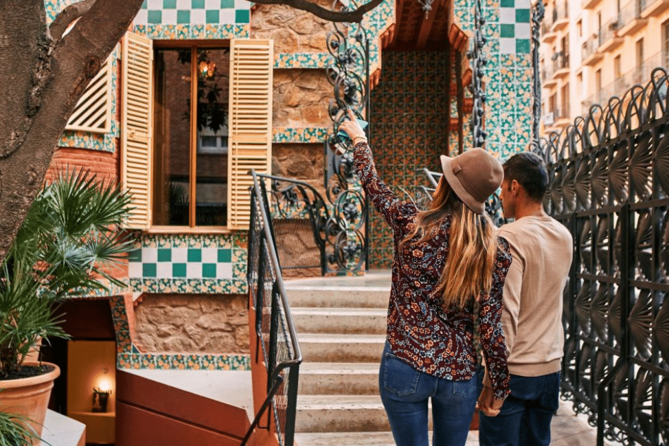 A couple standing infront of Casa Vicens, admission ticket