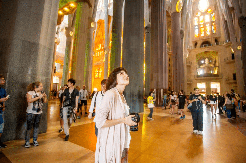 A girl walking inside Sagrada Familia, church, Spain 