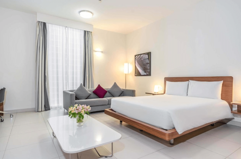 Aparthotel Adagio Abu Dhabi Al Bustan Room, bed, couch, coffee table, Abu Dhabi best hotels