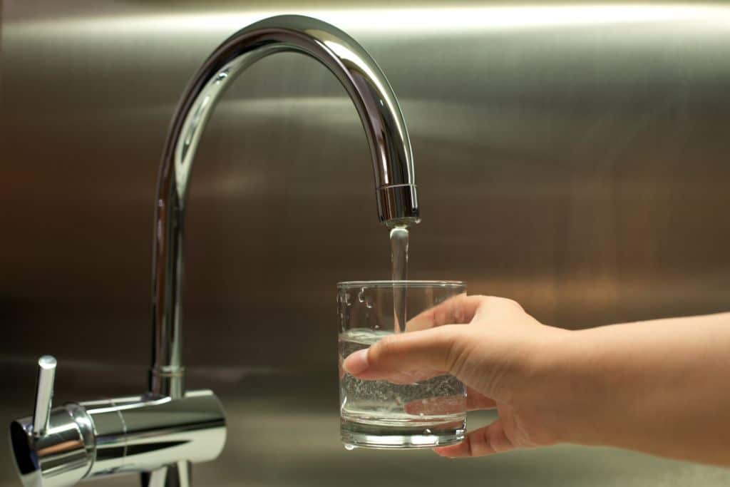 glass of water, drinking water, faucet, hand reaching for water, tap, sink