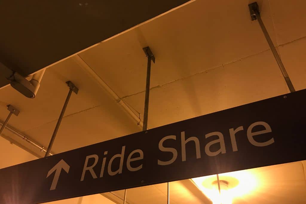 This is an example of what the signs at airports look like. They are pointing to where the Ride Share pick-up area is