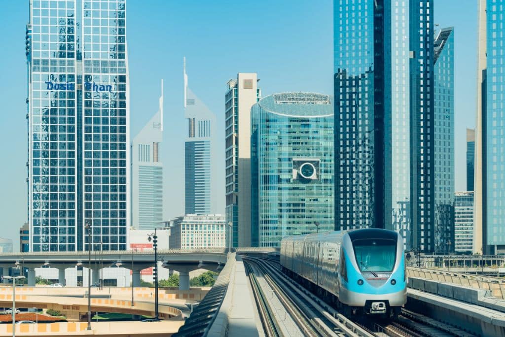 Dubai subway system, elevated subway, train, tracks, buidlings 