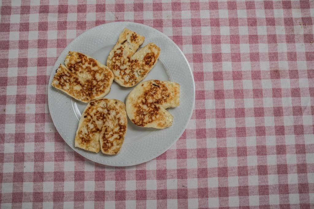Grilled Halloumi on a plate on a table, cheese, gilled cheese