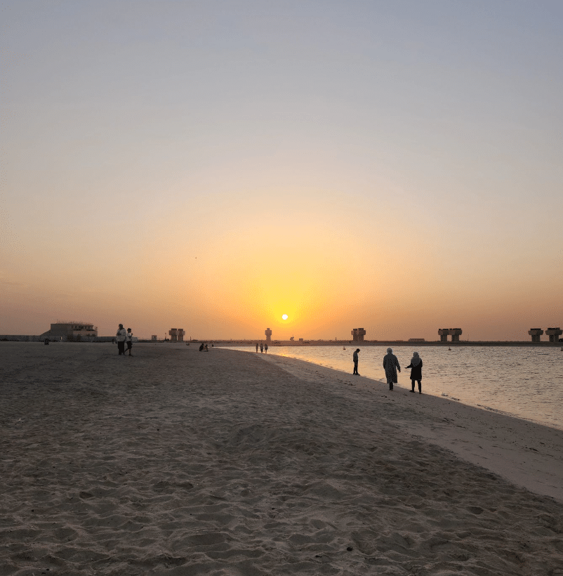 Jebel Ali Beach at sunset, people walking on a beach, Dubai beaches, Dubai hidden gems
