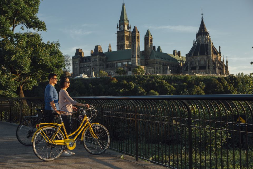 A couple overlooking Parliament Hill on a self guided bike tour, Ottawa Bike Tours