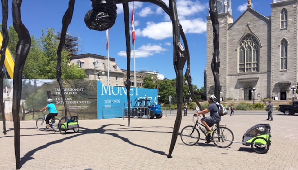 Biking in front of the National Gallery of Canada, biking your in Ottawa