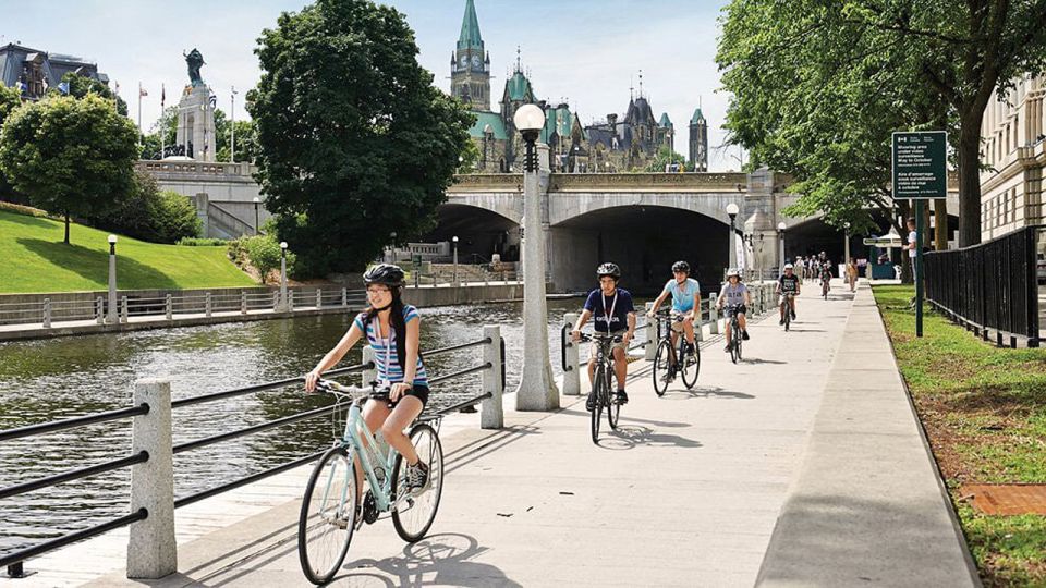 A group of people biking along the Rideau Canal in Ottawa