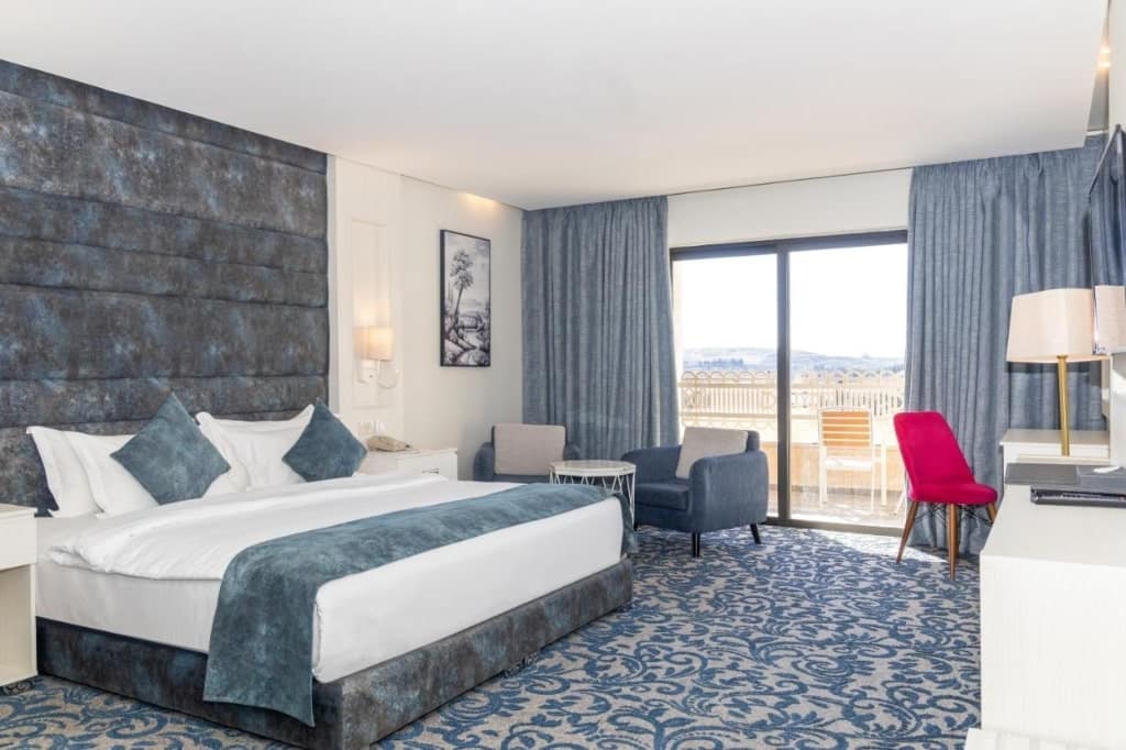 A room in Opal Hotel Amman, a large bed, hotel in Jordan