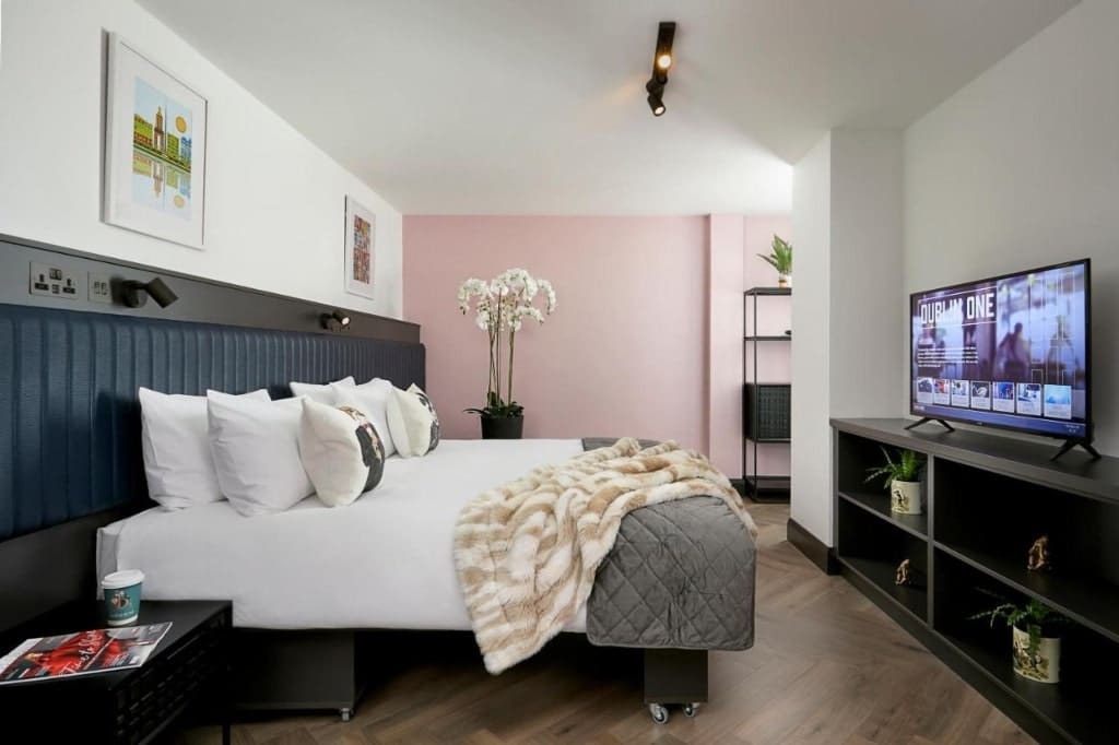 A room in Dublin One, a large hotel bed, a tv, Dublin Hotels Near Croke Park