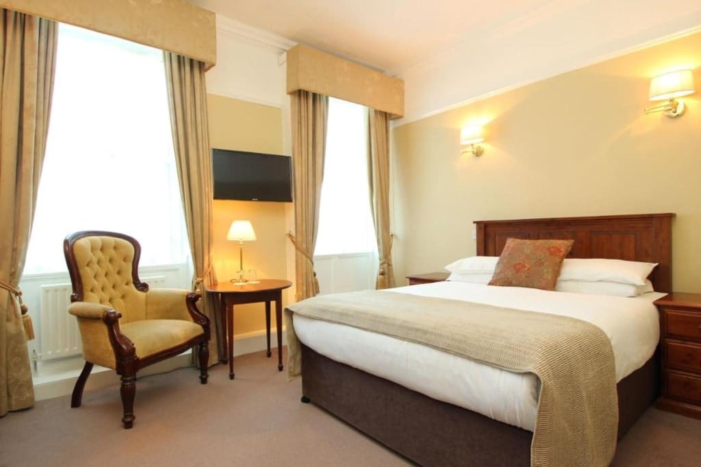 A room in the Castle Hotel, a hotel bed, chair, Dublin Hotels Near Croke Park