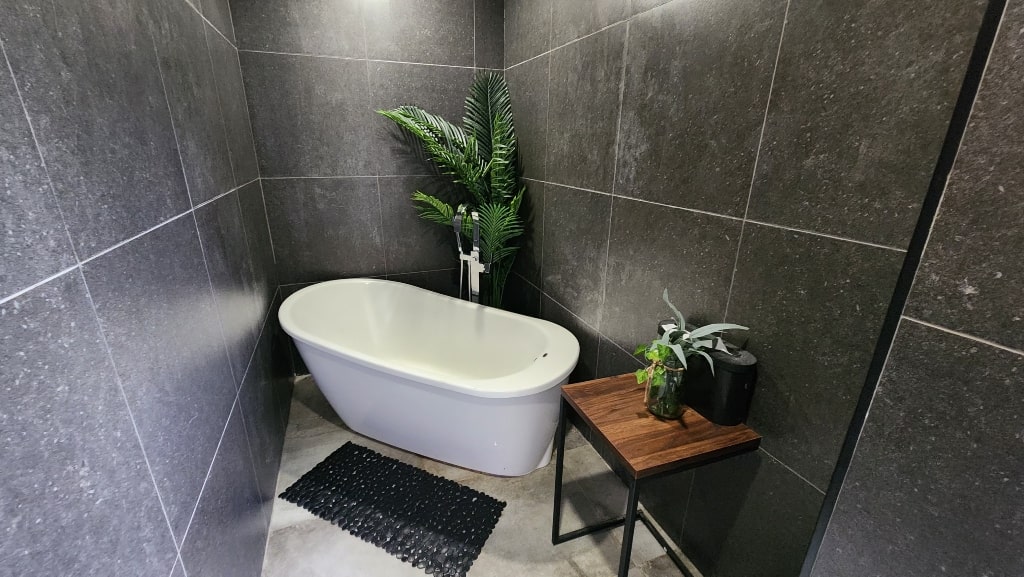 A bathtub, modern bath, washroom, Lungovita Beach Resort Review