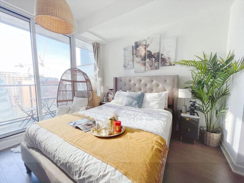 INFIVILLA Deluxe Suites bedroom, nice design, egg chair, balcony, house plants