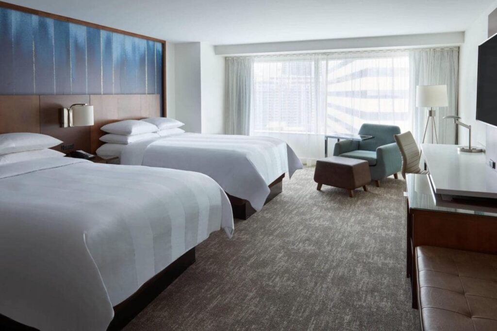 A room in the Toronto Marriott City Centre Hotel, two beds in a hotel room, a desk, chair