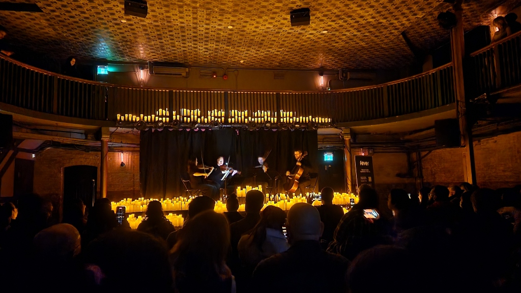 Candlelight concert venue in Toronto, candles, stage, audience, musicians on a stage