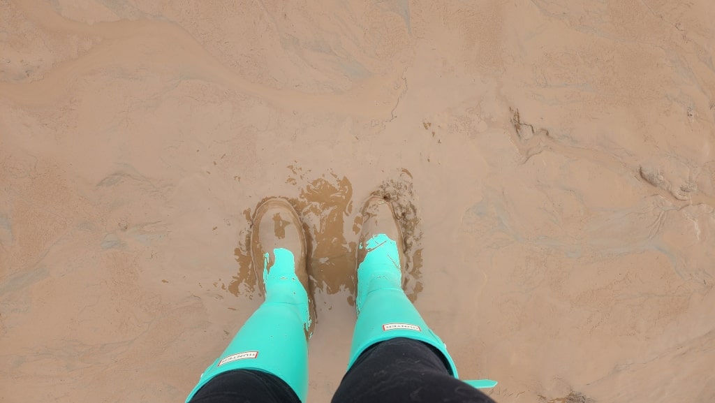 rain boots in mud, muddy ground