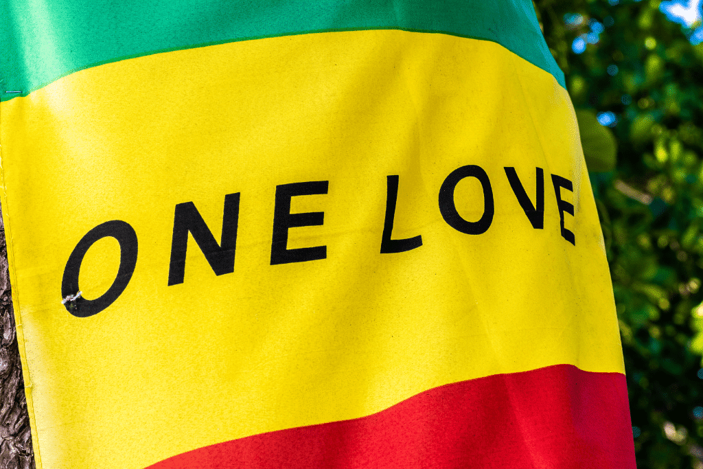 Jamaica is the birthplace of Reggae music, a flag that says One Love