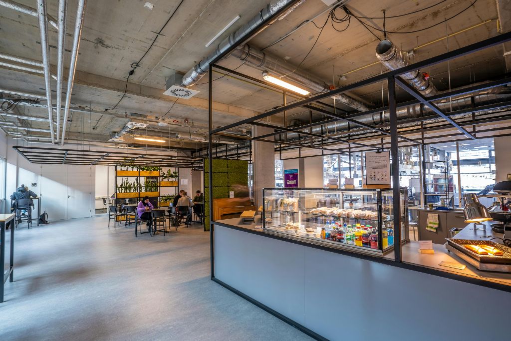 A small restaurant in an airport, even if you’re not hungry right away, grabbing something to eat now can save you from getting stuck with overpriced or limited options closer to your gate