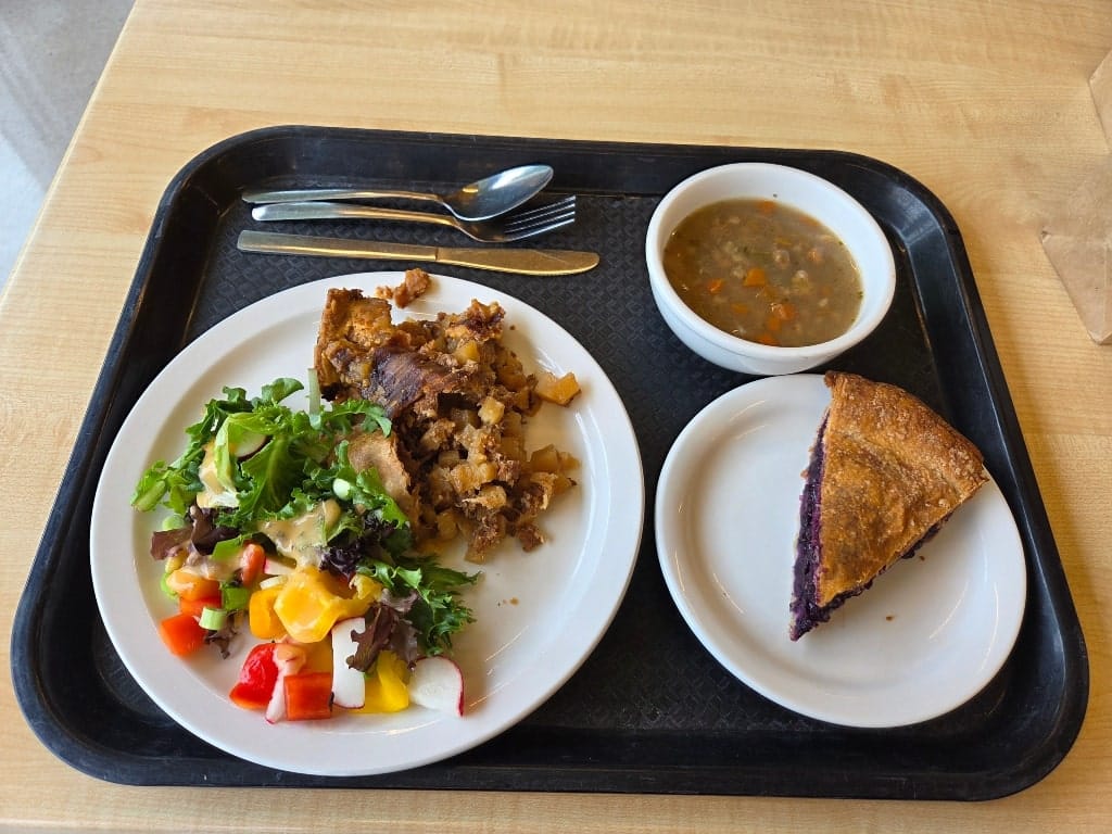 A tray with soup, tourtière, salad and a blueberry pie, What is Saguenay-Lac-Saint-Jean known for? - Its delicious food