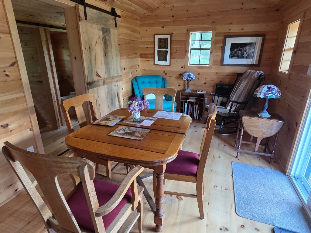 Inside the Havens’ Hub, small cabin living space with a table and chairs