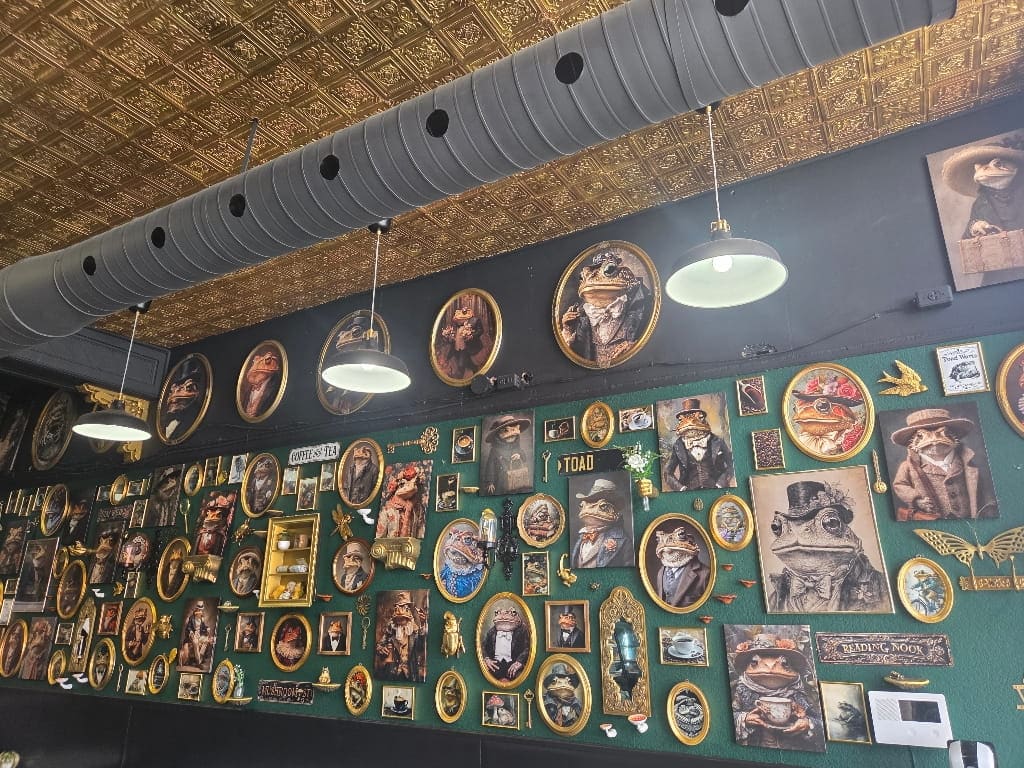 The decor inside the Toasted Toad Café, frog art