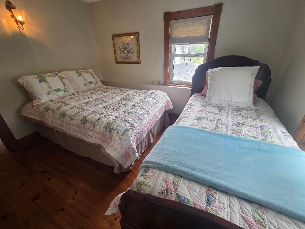 One of the bedrooms in the Farmhouse, two beds