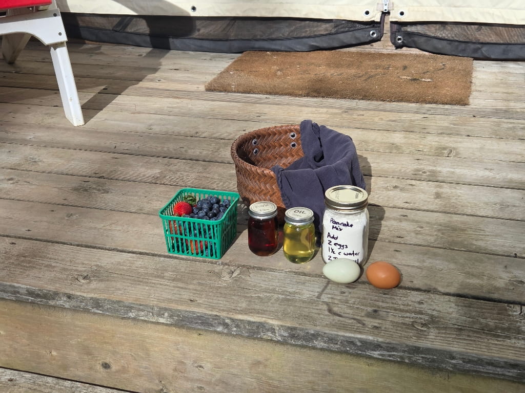The contents of the breakfast basket (the pancake option), fruits, basket