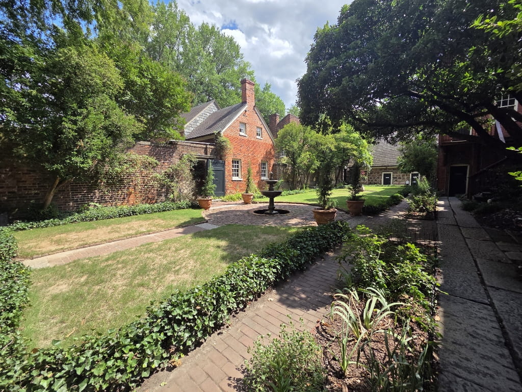 The garden in the Edgar Allan Poe Museum, fountain, brick house, courtyard