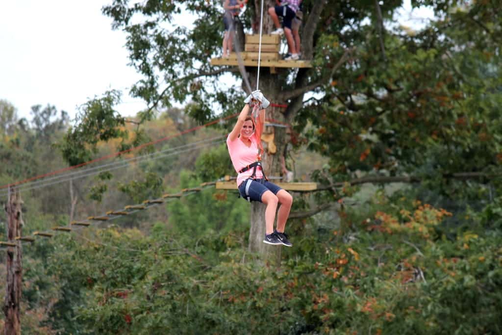 Treetop Zoofari Course - zip line, a girl on a zipline