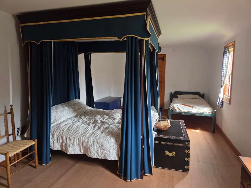 The primary bedroom in Ferry Farm, canopy bed 