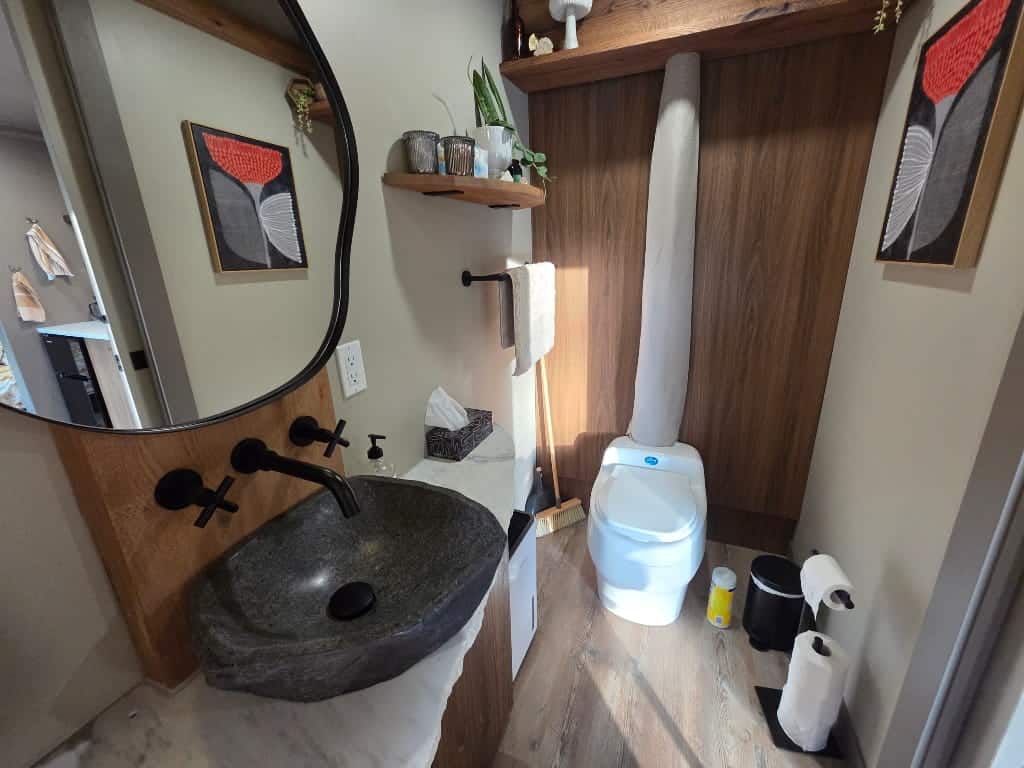 A bathroom with a compost toilet, The Burrow Airbnb Review